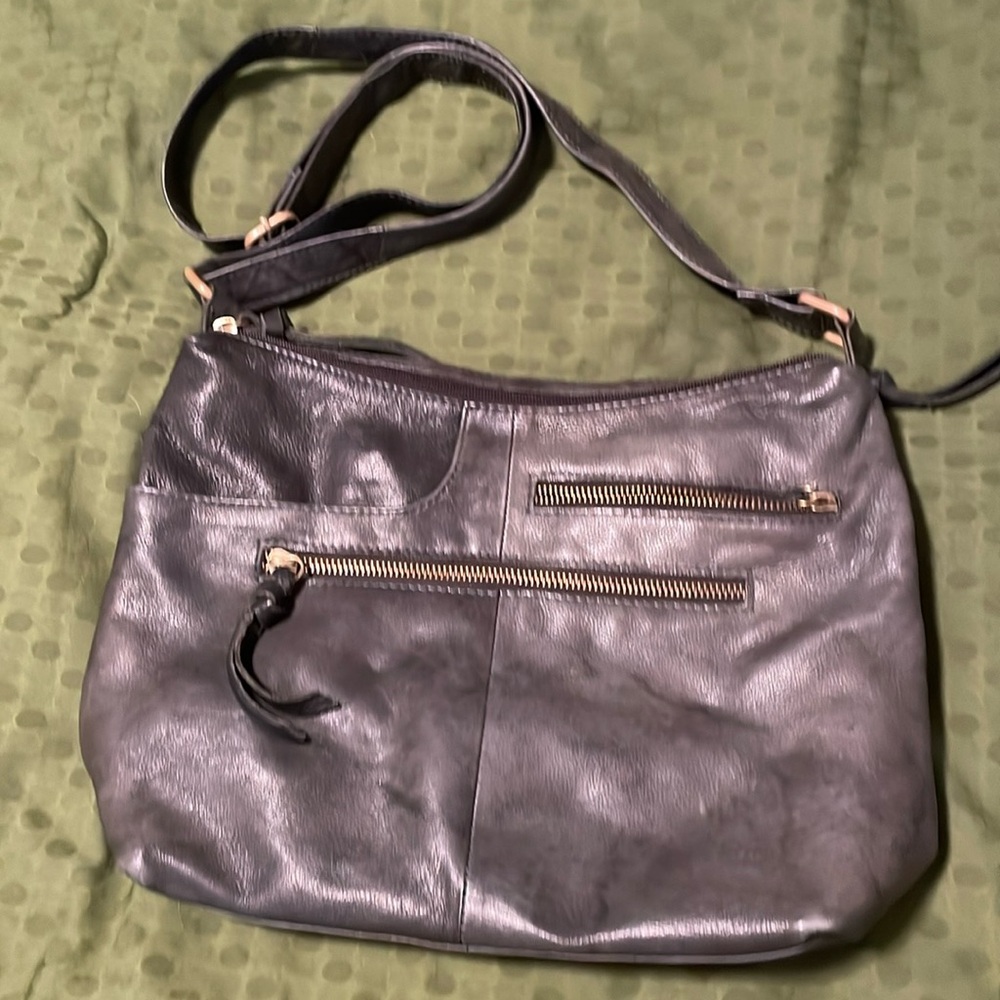 Gray adjustable leather purse.